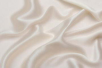 eige cream or ivory silk satin. Draped fabric. Light pale brown luxury background for design. Flat...