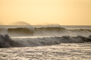 Scenic view of heavy sea waves in the evening