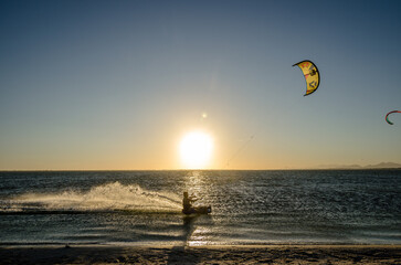 Scenic view of a tourist doing kite surfing in the sea