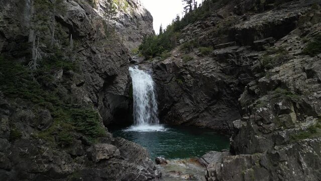 Aerial of Devils Punchbowl waterfall in Crested Butte Colorado with blue pools of water