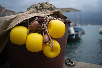 Closeup of fishing nets with yellow buoys at Portoferraio port in Elba Italy