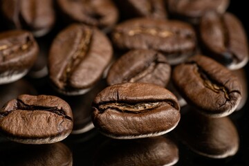 Closeup of coffee beans on a reflective background
