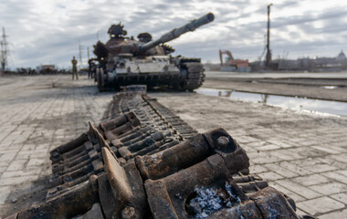 damaged military tank on a city street in Ukraine