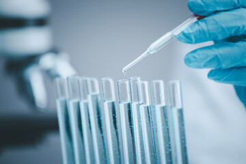 Microscope with lab glassware, nanotechnology conducting research fiber microfiber microbiology...