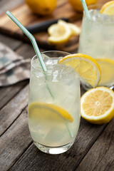 Glass of cold lemonade with lemon slices