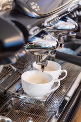 Barista coffee service concept.Barista women using coffee machine to make coffee in cafe