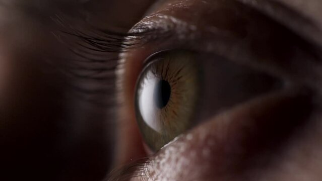 Man's Eye Opens Slow Motion, Extreme Close Up. Close-up of Iris and Pupil of Eye