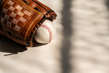 baseball and glove on a white background