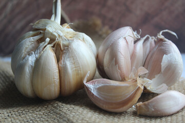 bunch of garlic on brown background