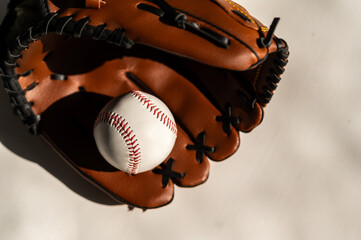 baseball and glove on a white background