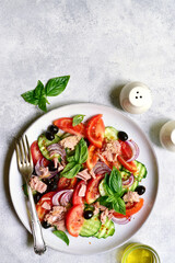 Fresh vegetable salad with tuna. Top view with copy space.