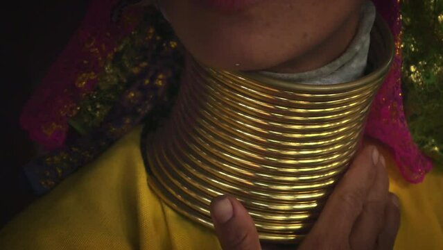 Thailand, Mae Hong Son. Jewelry rings on neck of Longneck Karen Woman