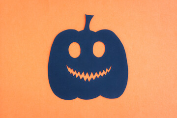 Happy Halloween, Pumpkin smile make from paper cut on orange background, Decorative Halloween concept
