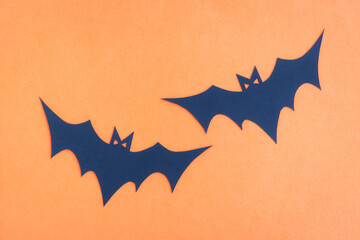 Happy Halloween, Bats flying make from paper cut on orange background, Decorative Halloween concept