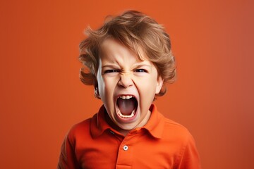 Angry irritated boy. Full of rage. Emotional portrait of an upset preteen boy screaming in anger. Requirements for parents. Wrong perception. Hysterics.