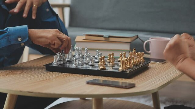 Pensioners pastime at senior home. Aged couple playing chess. Activities for seniors, elderly active lifestyle, older people time spending concept
