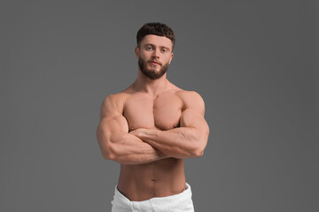 Fototapeta premium Handsome muscular man on grey background. Sexy body
