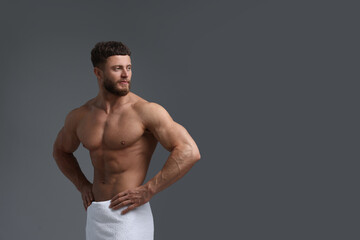 Handsome muscular man on grey background, space for text. Sexy body