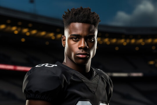 Portrait of serious afro american young confident male athlete rugby player at stadium outdoors looking at camera
