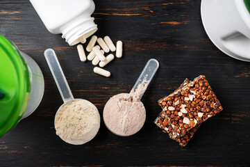 Two scoops of whey or soy protein powder, white capsules of amino acids, vitamins, creatine,...