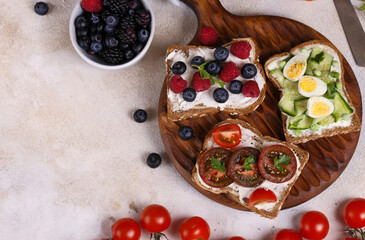various sandwiches for a healthy diet on a wooden board
