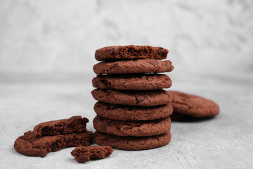 Fototapeta na wymiar Tasty chocolate cookies on light grey table, closeup