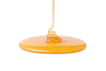 Pouring tasty natural honey isolated on white