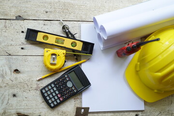 Set of professional construction tools and safety helmet on a work table. Top view. Tools. Various...