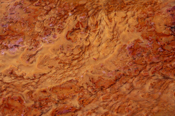 The result of iron waste deposits that are brown and blurred contained in soil with a high iron content 