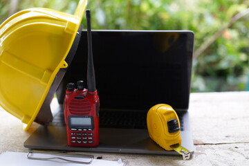 Set of professional construction tools and safety helmet on a work table. Top view. Tools. Various tools on a wooden table. engineering drawing Tools to work beyond architectural blueprints