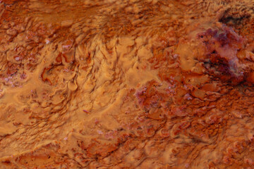 The result of iron waste deposits that are brown and blurred contained in soil with a high iron content 