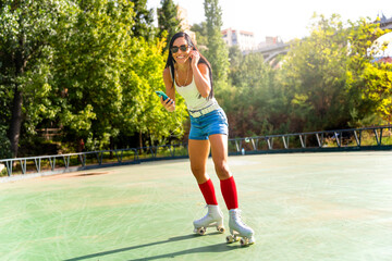 Beautiful girl rollerskating in morning city