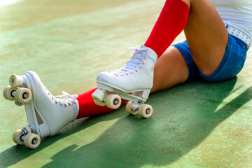 Roller girl resting on the steps