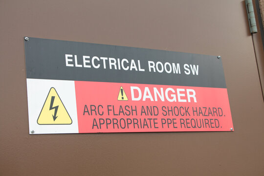 electrical room sw danger arc flash and shock hazard appropriate ppe required sign on brown metal entrance door