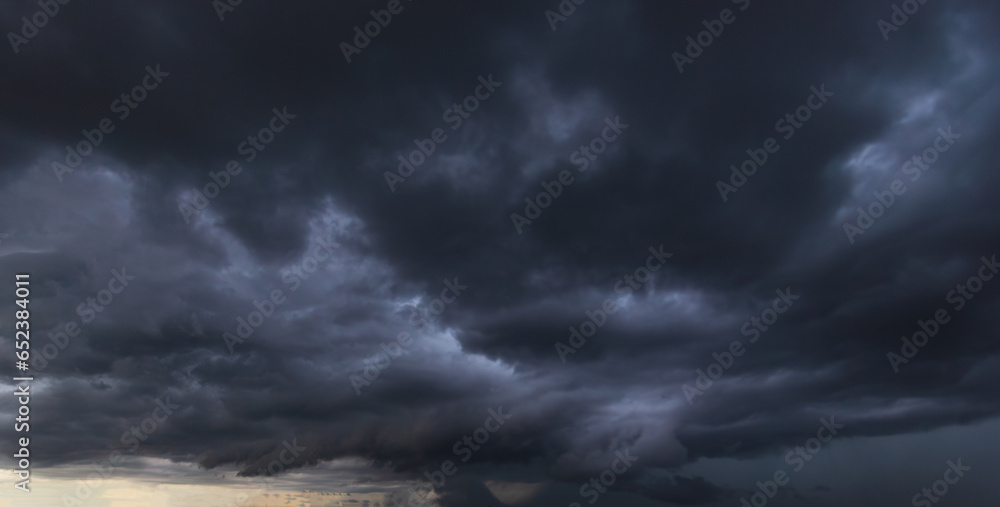 Poster bad or moody weather sky and environment.the dark sky with heavy clouds converging and a violent sto