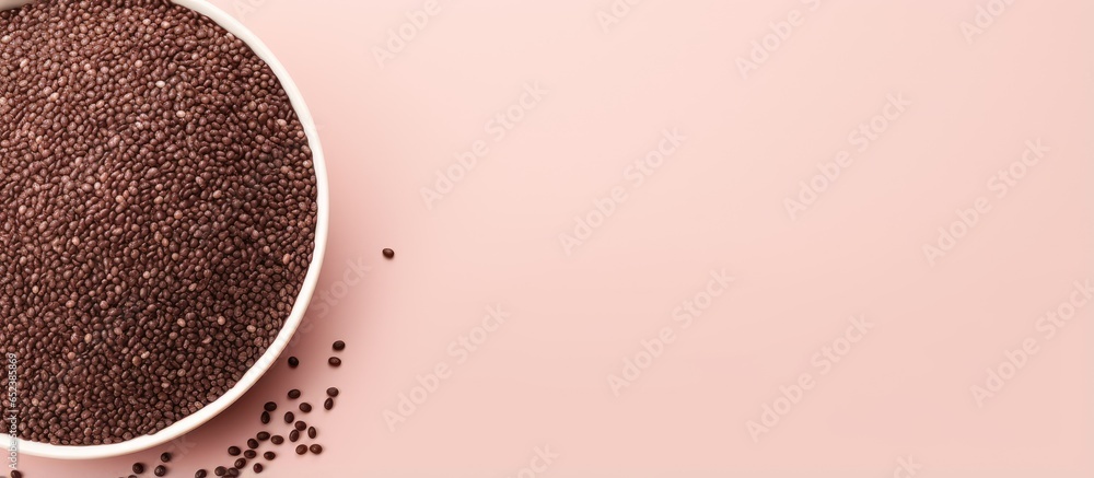 Aufkleber Chia word made from seeds Chia seeds bowl from top view with space Grain isolated pastel background Copy space
