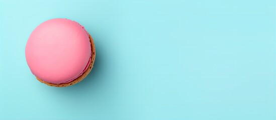 Fototapeta premium A vibrant macaroon against a isolated pastel background Copy space