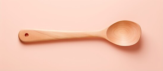 Cooking utensil made of wood placed on a isolated pastel background Copy space