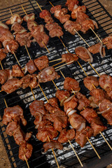 Roasted meet during cooking on mesh