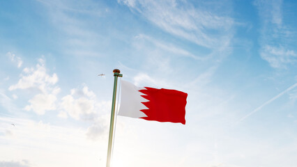 Flag of Qatar flag waving in the wind, sky and sun background. Qatar Flag.