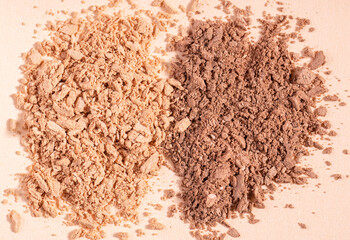 Makeup cosmetics. Eyeshadow or blush crushed palette, colorful eye shadow powder on beige background