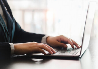 Businessman typing on laptop computer keyboard working online on table in office. Facebook chat. Web meeting. Blogger. Journalist writing an article. online job ideas