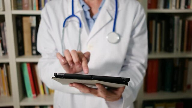 Explore as Dr. examines mobile devices and tablets in her medical attire within her office. Discover how these tools transform patient care and healthcare management.