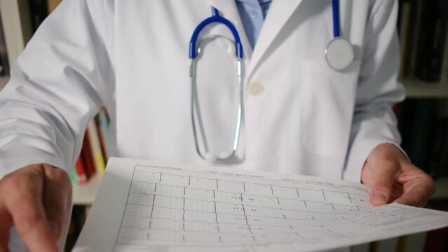 Join Dr. as she reviews cardiac probes and electrograms in her medical attire within her office. Explore the crucial role of these tests in heart health assessment and diagnosis. A captivating journey