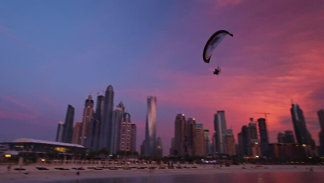 Paramotors Flying Across Sunset Lit Sky of Dubai