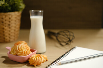 homemade cookies and a glass of milk on the table.