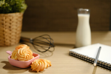 homemade cookies and a glass of milk on the table.