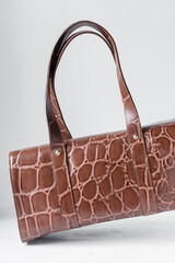 Close up of handmade brown embossed calfskin leather handbag, handmade leather bowler bag, artisan...