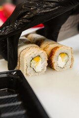 sushi rolls with fish cook for deliveryadvertising