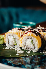 sushi rolls for advertising in an expensive restaurant on blue plates